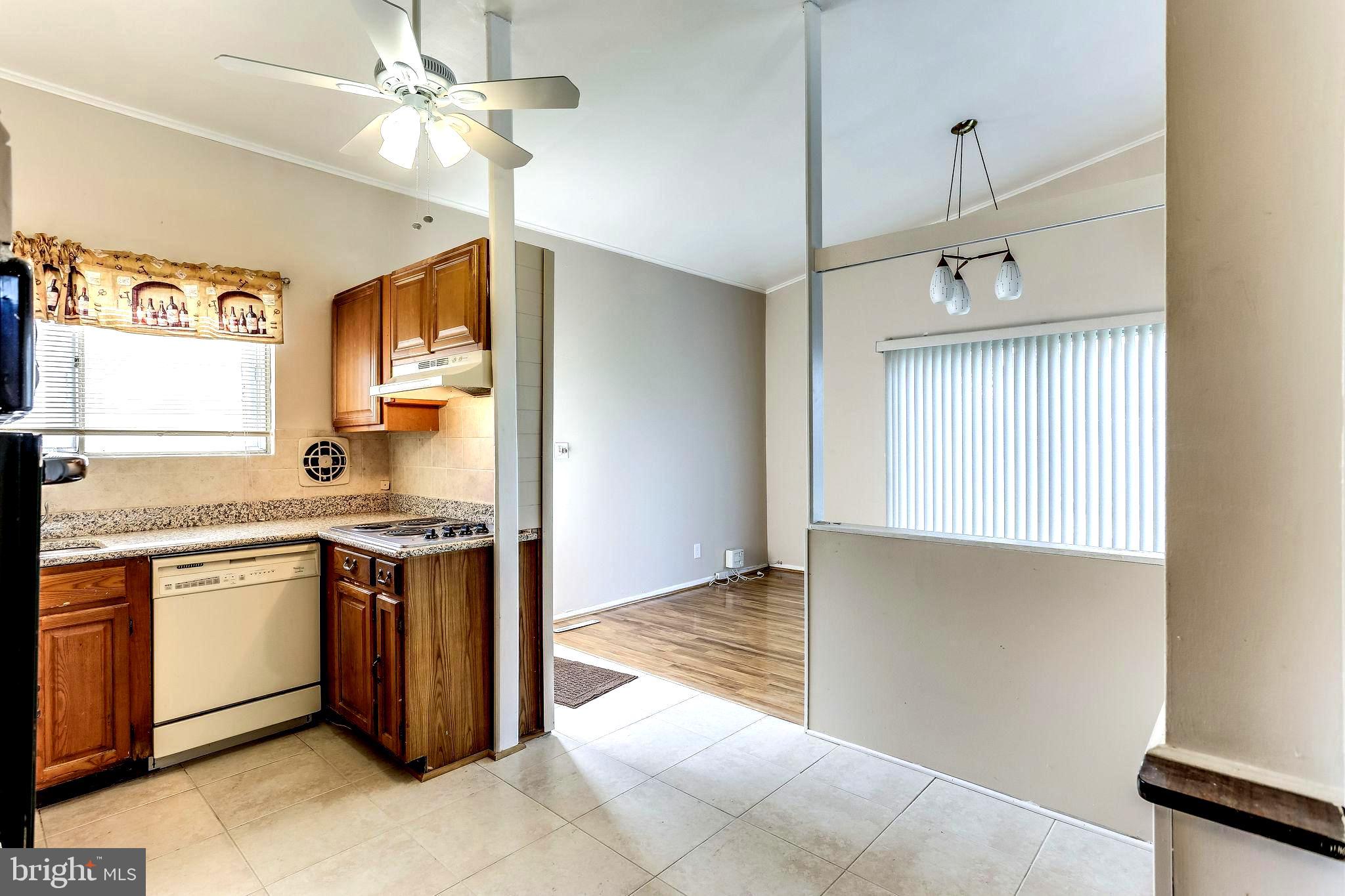 4729 Belle Forte Road Baltimore, MD 21208 - Photo 18 of 46 Kitchen with Granite Counter & Ceiling Fan