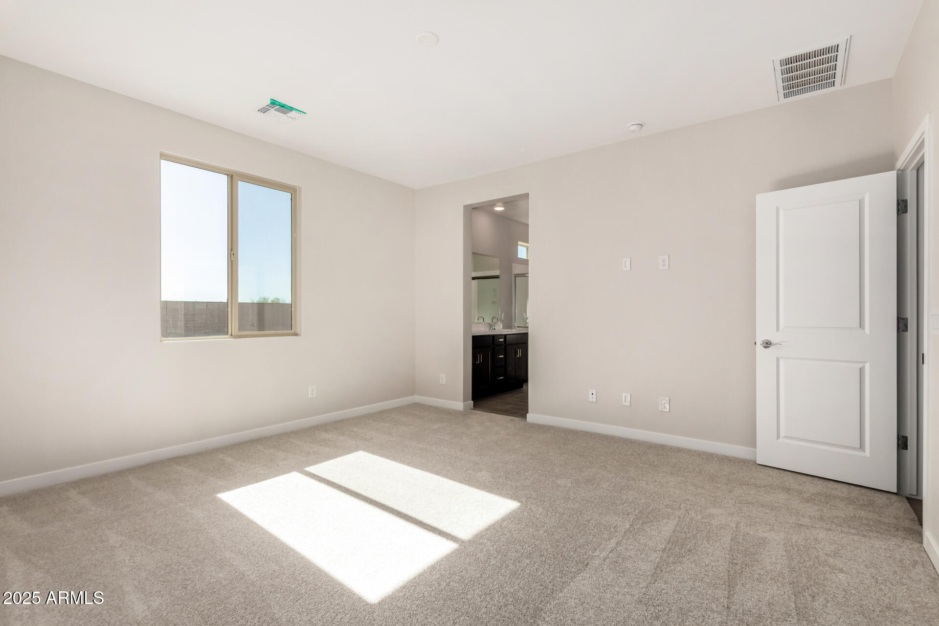 16977 West Spur Drive Surprise, AZ 85387 - Photo 14 of 30 a view of an empty room with a window