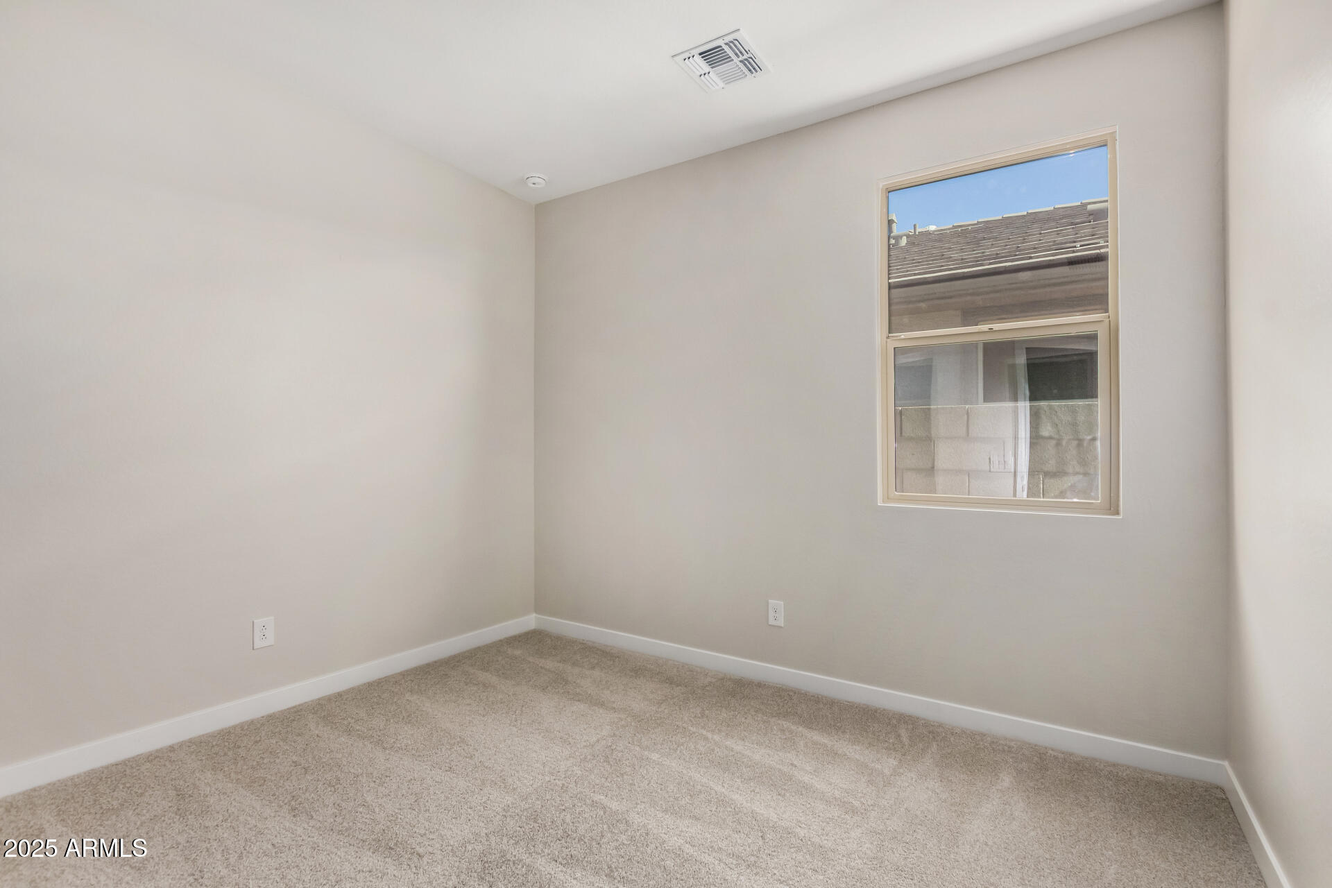 16977 West Spur Drive Surprise, AZ 85387 - Photo 19 of 30 an empty room with a window