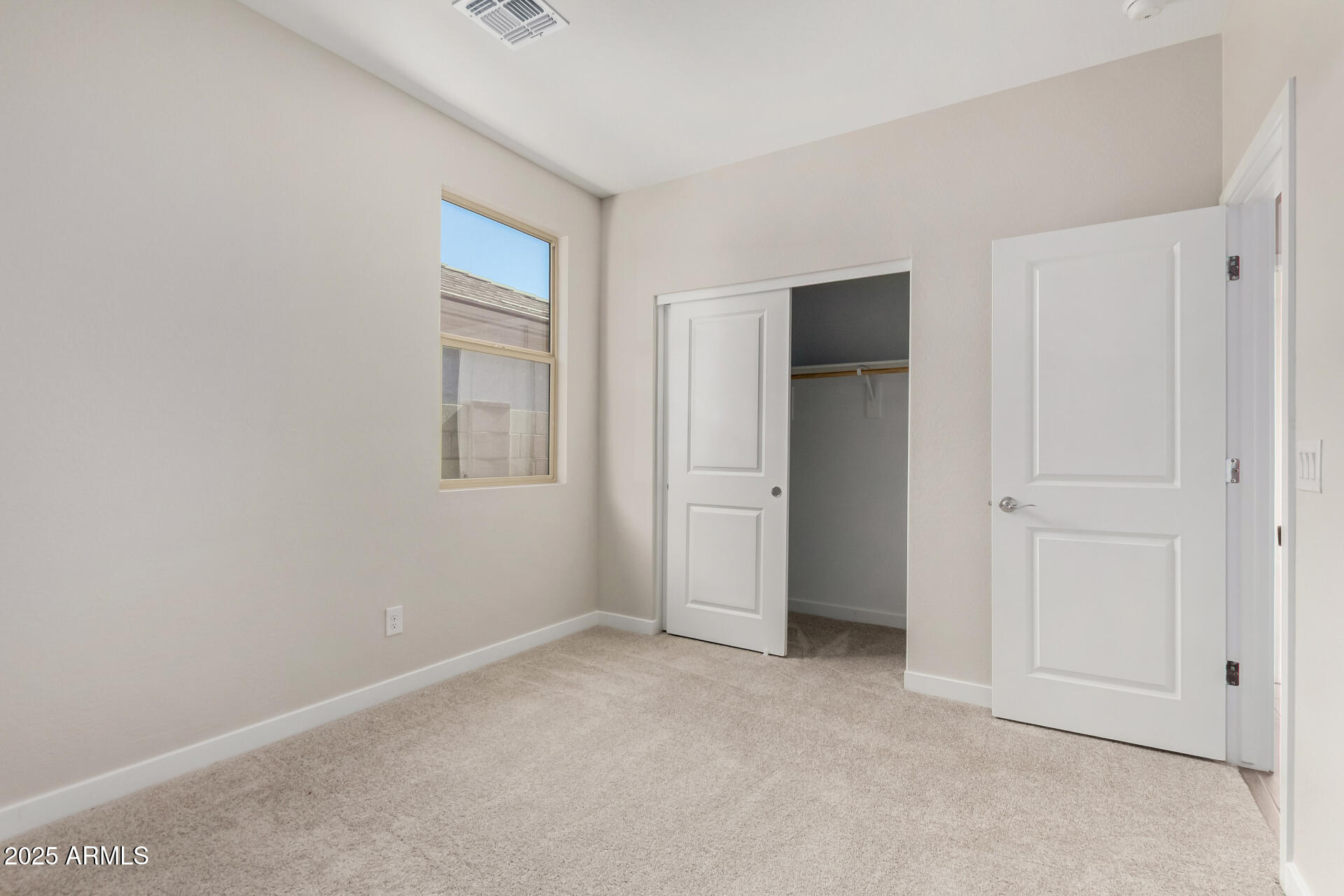 16977 West Spur Drive Surprise, AZ 85387 - Photo 20 of 30 an empty room with windows and closet