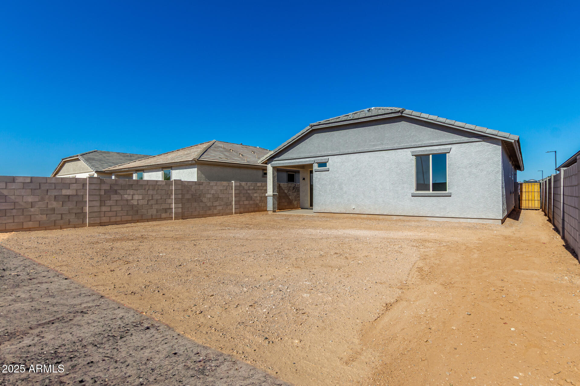 16977 West Spur Drive Surprise, AZ 85387 - Photo 27 of 30 a front view of a house with a yard