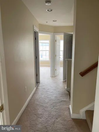 a view of a room with a hallway