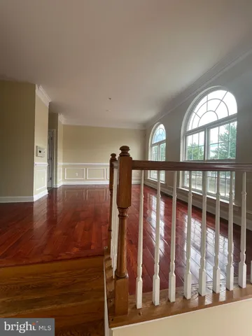 a view of entryway with wooden floor