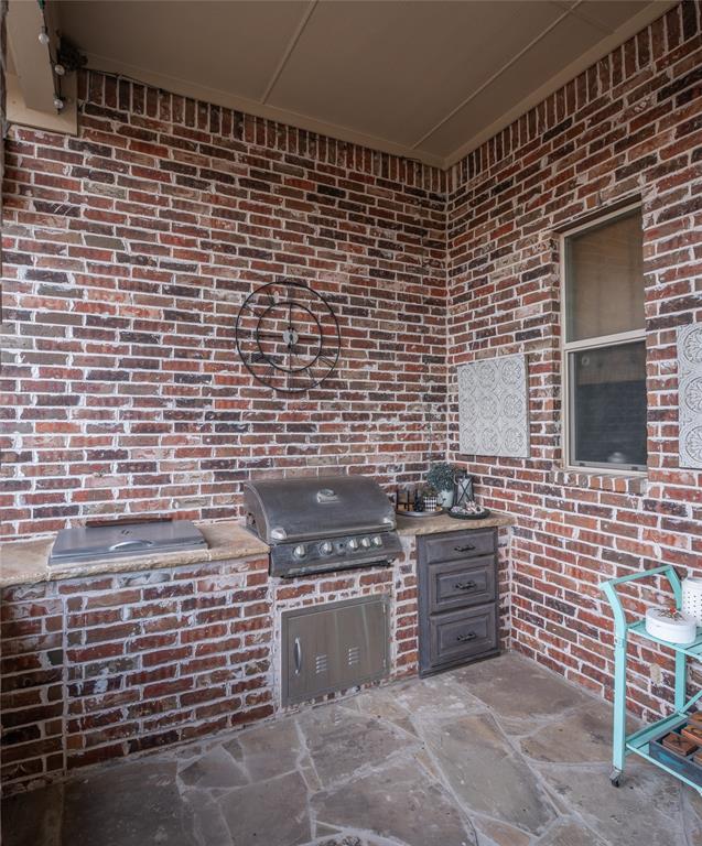 811 Red Store Court Lucas, TX 75002 - Photo 26 of 31 a brick oven with stainless steel appliances