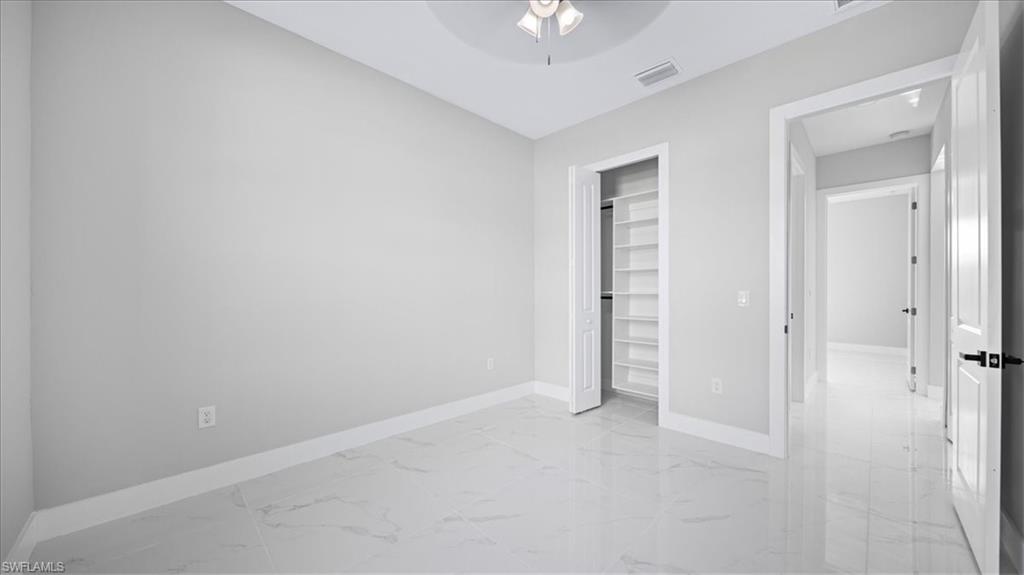 926 Winters Street East Lehigh Acres, FL 33974 - Photo 22 of 36 an empty room with a bathroom