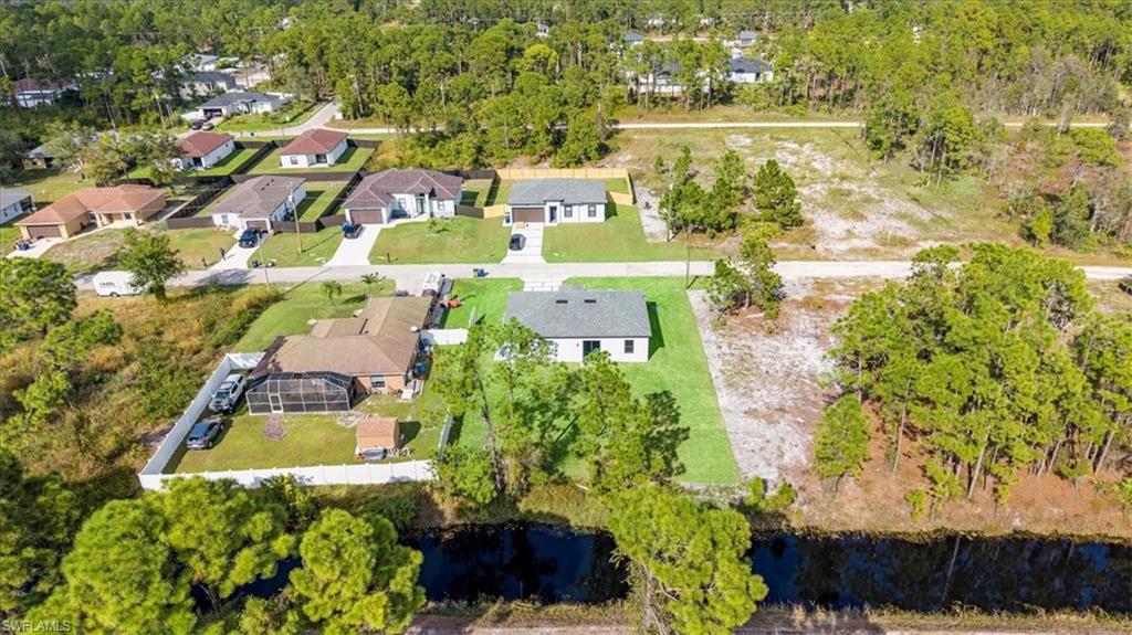 926 Winters Street East Lehigh Acres, FL 33974 - Photo 34 of 36 an aerial view of residential houses with outdoor space