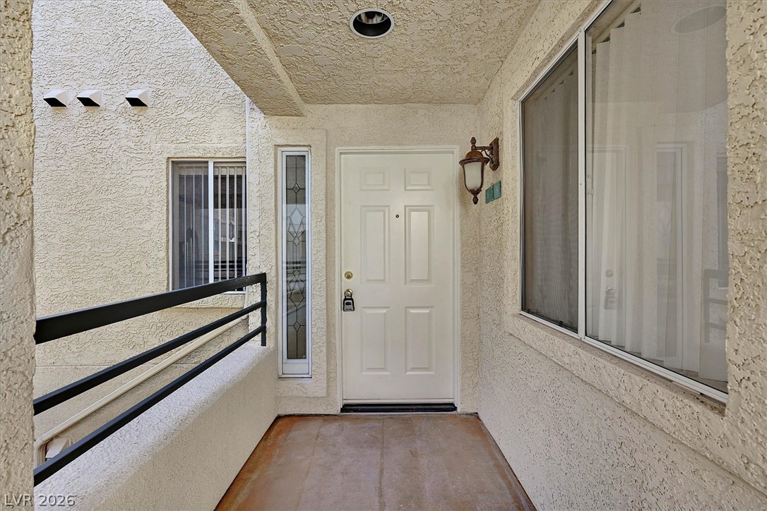 220 East Flamingo Road, Unit 305 Las Vegas, NV 89169 - Photo 1 of 26 A welcoming front entrance features a classic white door and a decorative sidelight.