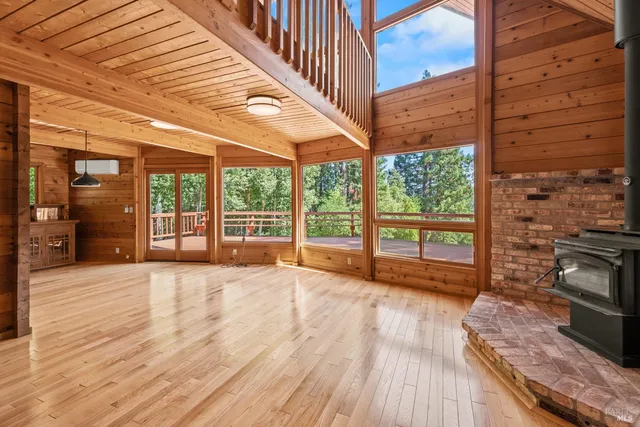 a view of an entryway with wooden floor