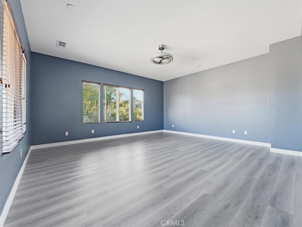 2947 Gilbert Avenue Corona, CA 92881 - Photo 34 of 60 wooden floor in an empty room with a window