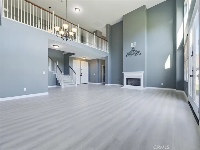 a kitchen with stainless steel appliances granite countertop a refrigerator and a stove