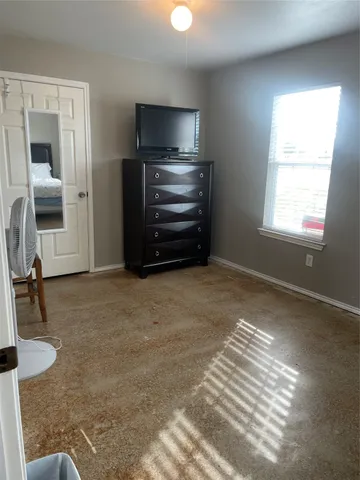 a room with furniture and a flat screen tv
