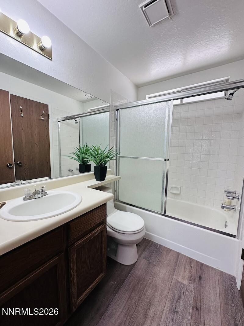 1182 Blue Lakes Road Reno, NV 89523 - Photo 15 of 31 a bathroom with a sink a toilet and shower