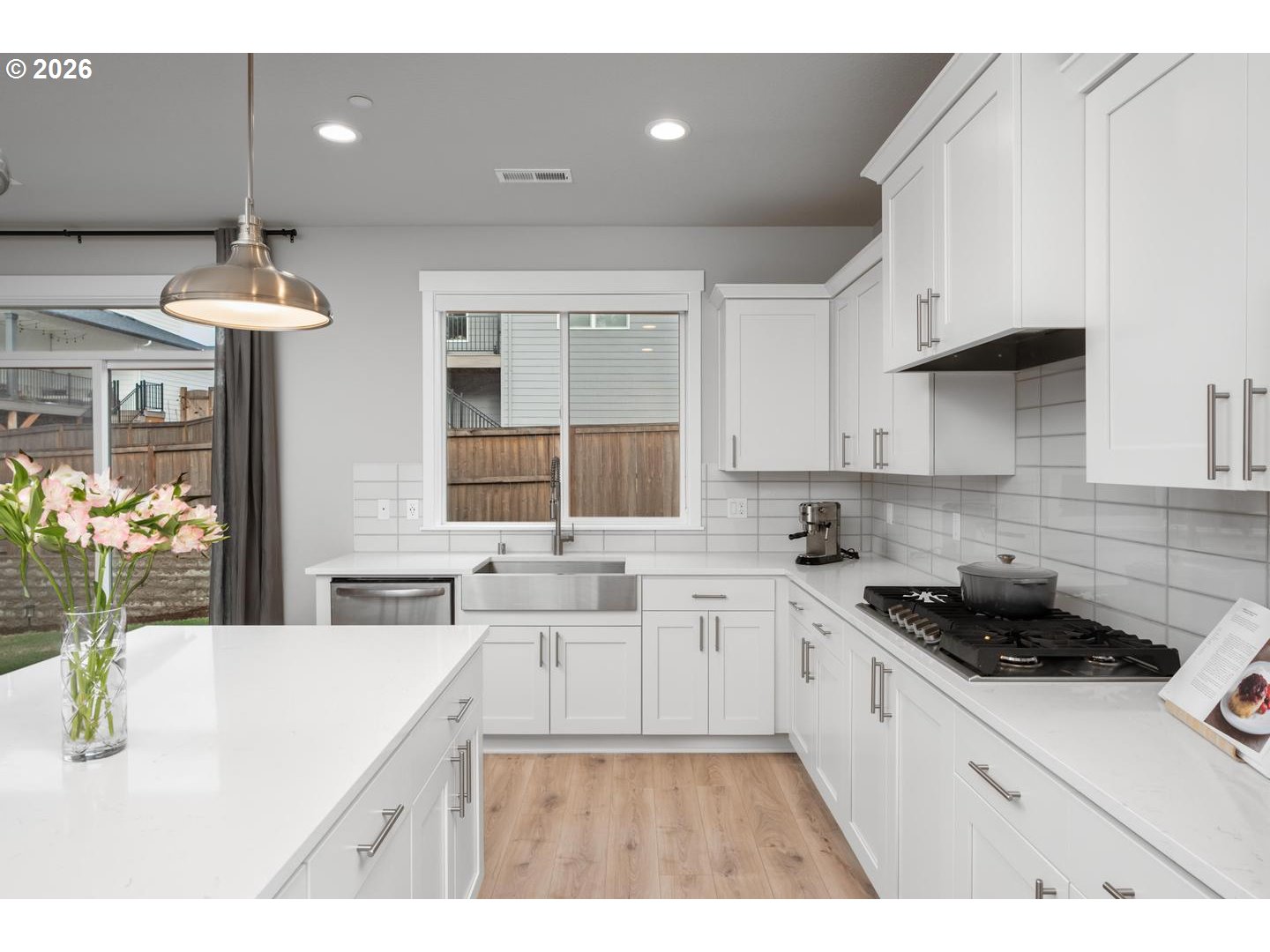 5489 North 91st Avenue Camas, WA 98607 - Photo 14 of 44 a kitchen with stainless steel appliances kitchen island granite countertop a sink and cabinets