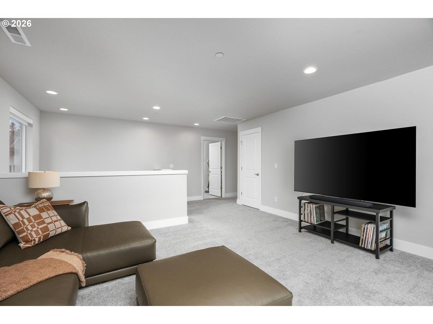 5489 North 91st Avenue Camas, WA 98607 - Photo 25 of 44 a living room with furniture and a flat screen tv
