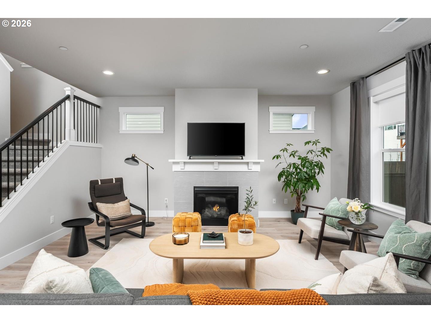 5489 North 91st Avenue Camas, WA 98607 - Photo 4 of 44 a living room with furniture a fireplace and a flat screen tv