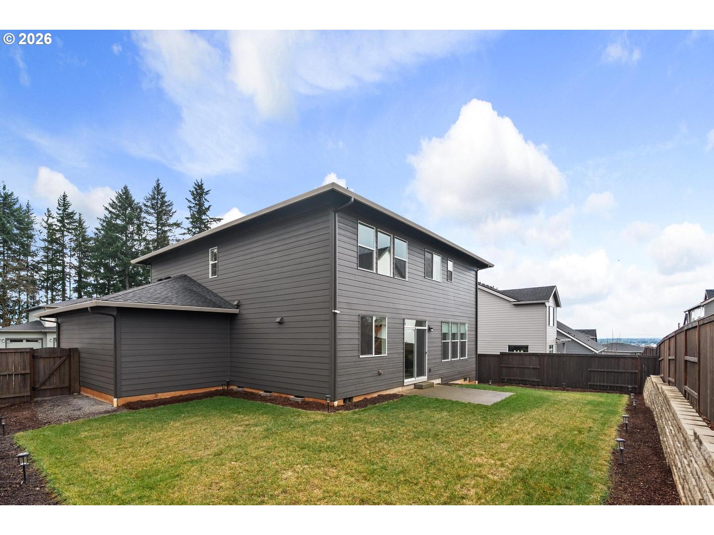 5489 North 91st Avenue Camas, WA 98607 - Photo 41 of 44 a backyard of a house with table and chairs