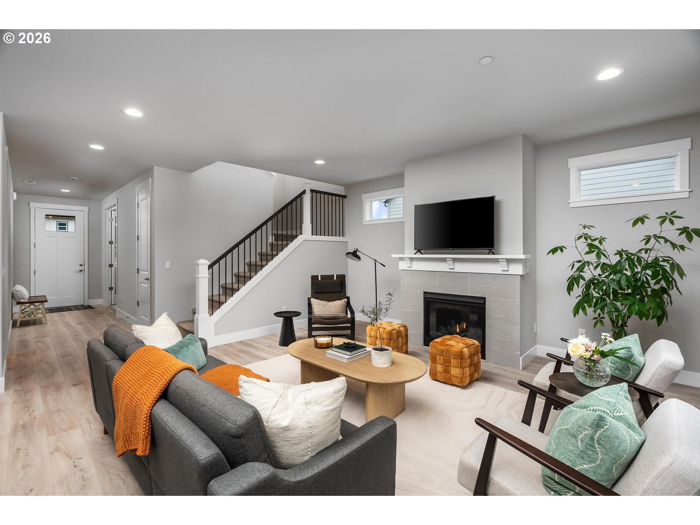 5489 North 91st Avenue Camas, WA 98607 - Photo 7 of 44 a living room with furniture a fireplace and a flat screen tv