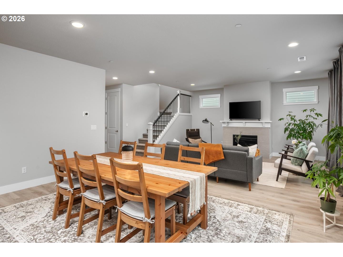 5489 North 91st Avenue Camas, WA 98607 - Photo 10 of 44 a living room with furniture kitchen view and a fireplace