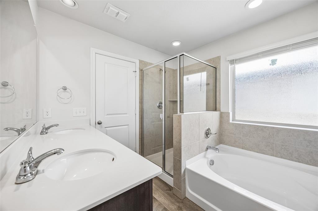 3807 Dogwood Road Melissa, TX 75454 - Photo 27 of 38 a bathroom with a tub sink and mirror