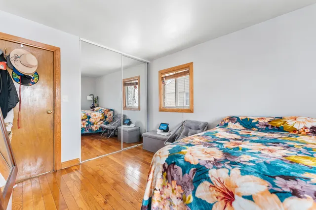 a bedroom with bed and a window