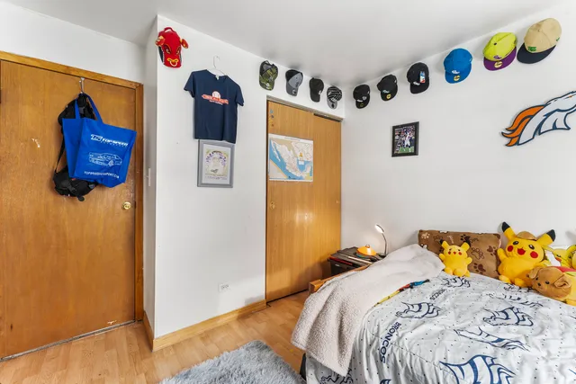 a bedroom with a bed and cabinets