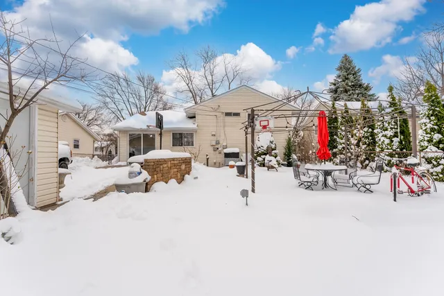 a view of a patio with a table and chairs