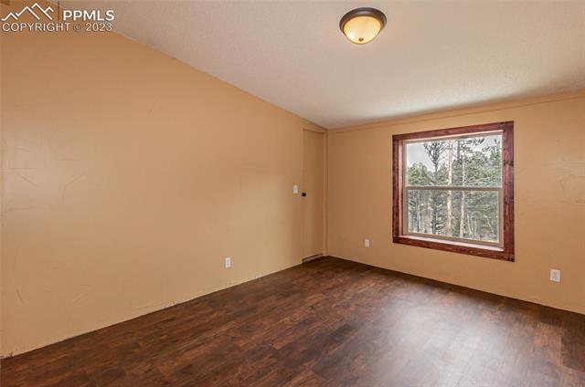861 Rangeview Road Divide, CO 80814 - Photo 15 of 18 Secondary bedroom #2 with beautiful flooring and walk in closet