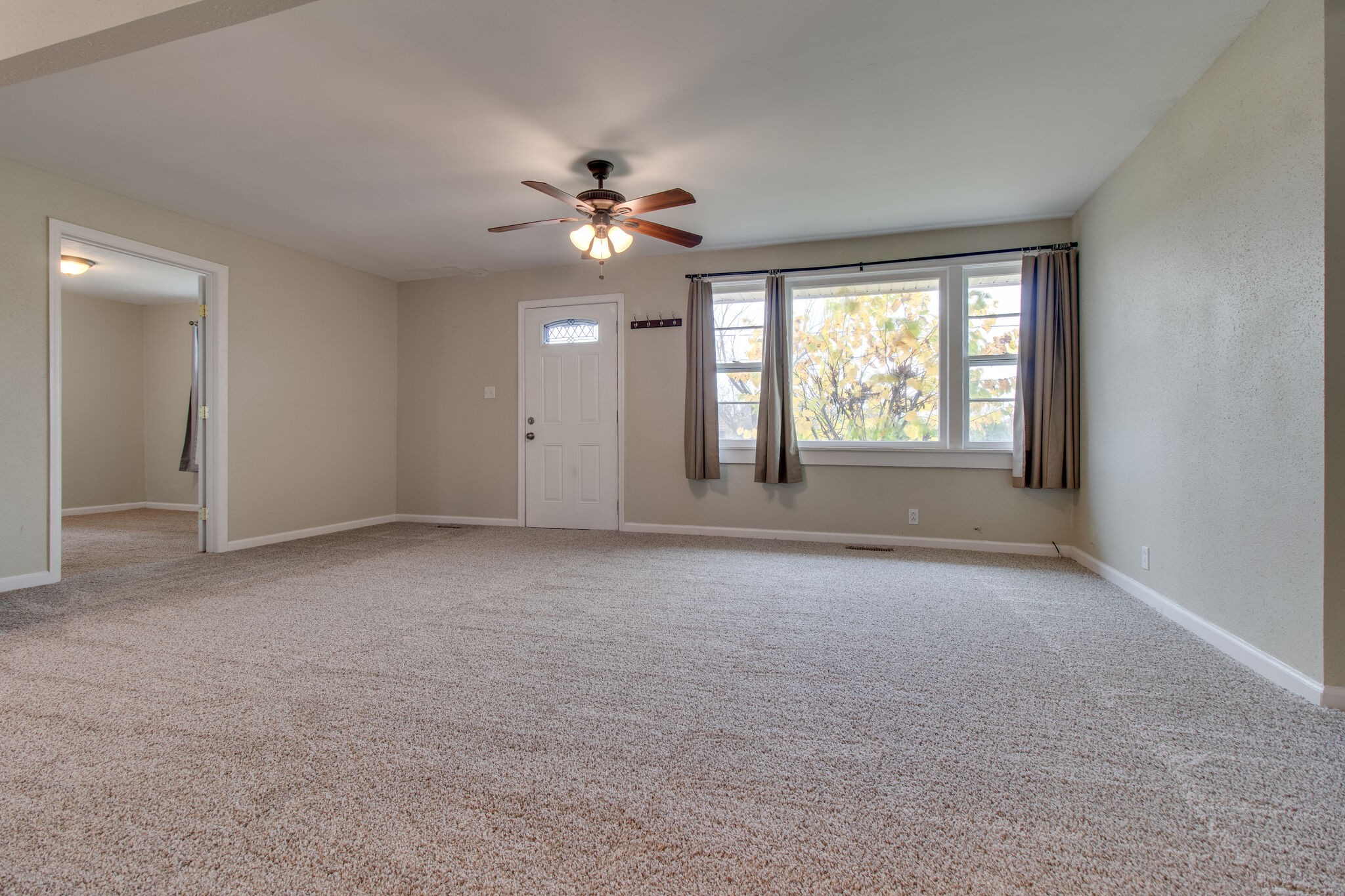 4942 Kedron Road Columbia, TN 38401 - Photo 5 of 17 an empty room with windows and ceiling fan
