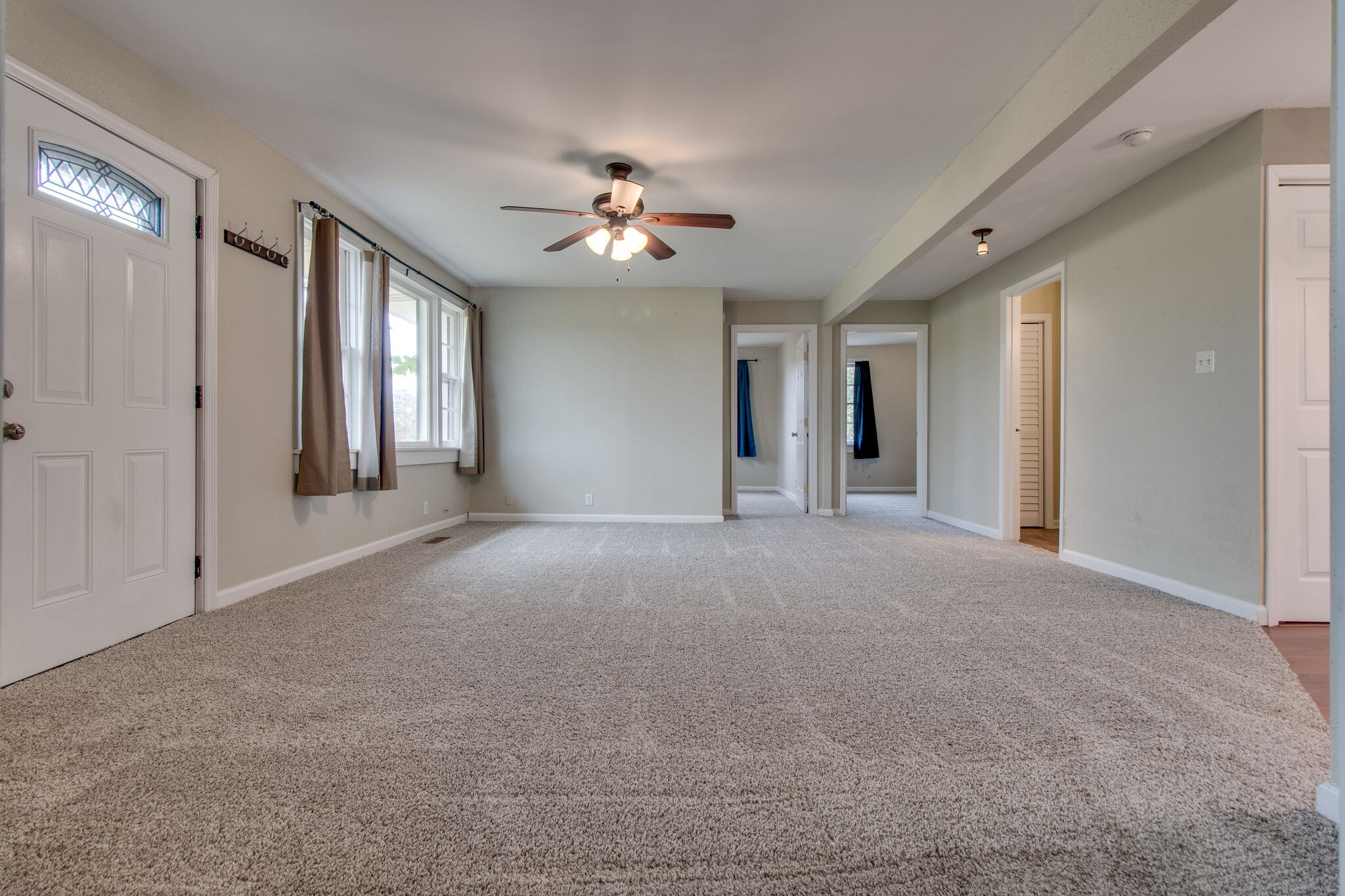 4942 Kedron Road Columbia, TN 38401 - Photo 6 of 17 a view of a big room with windows and chandelier fan