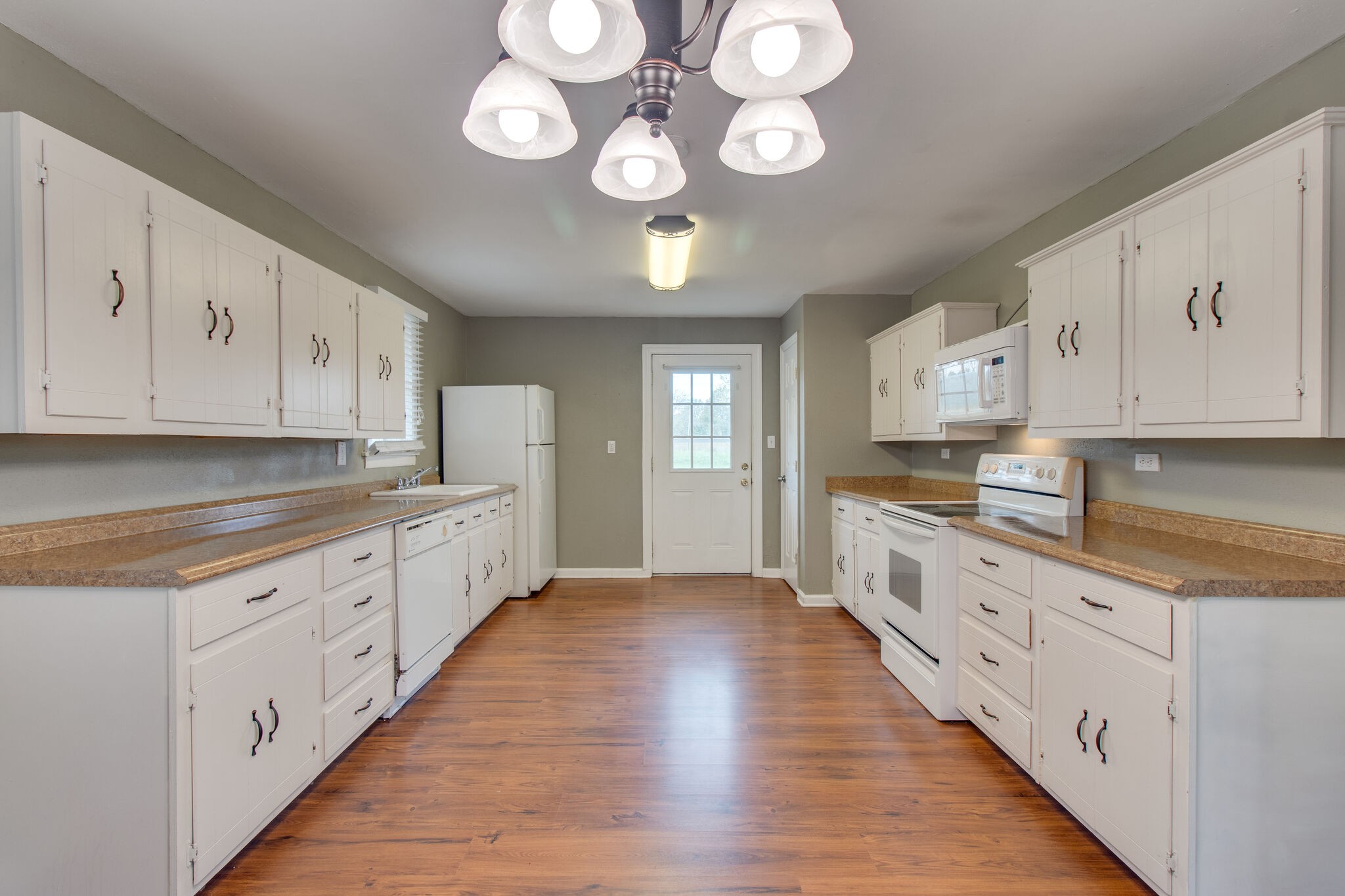 4942 Kedron Road Columbia, TN 38401 - Photo 8 of 17 a large kitchen with cabinets and wooden floor