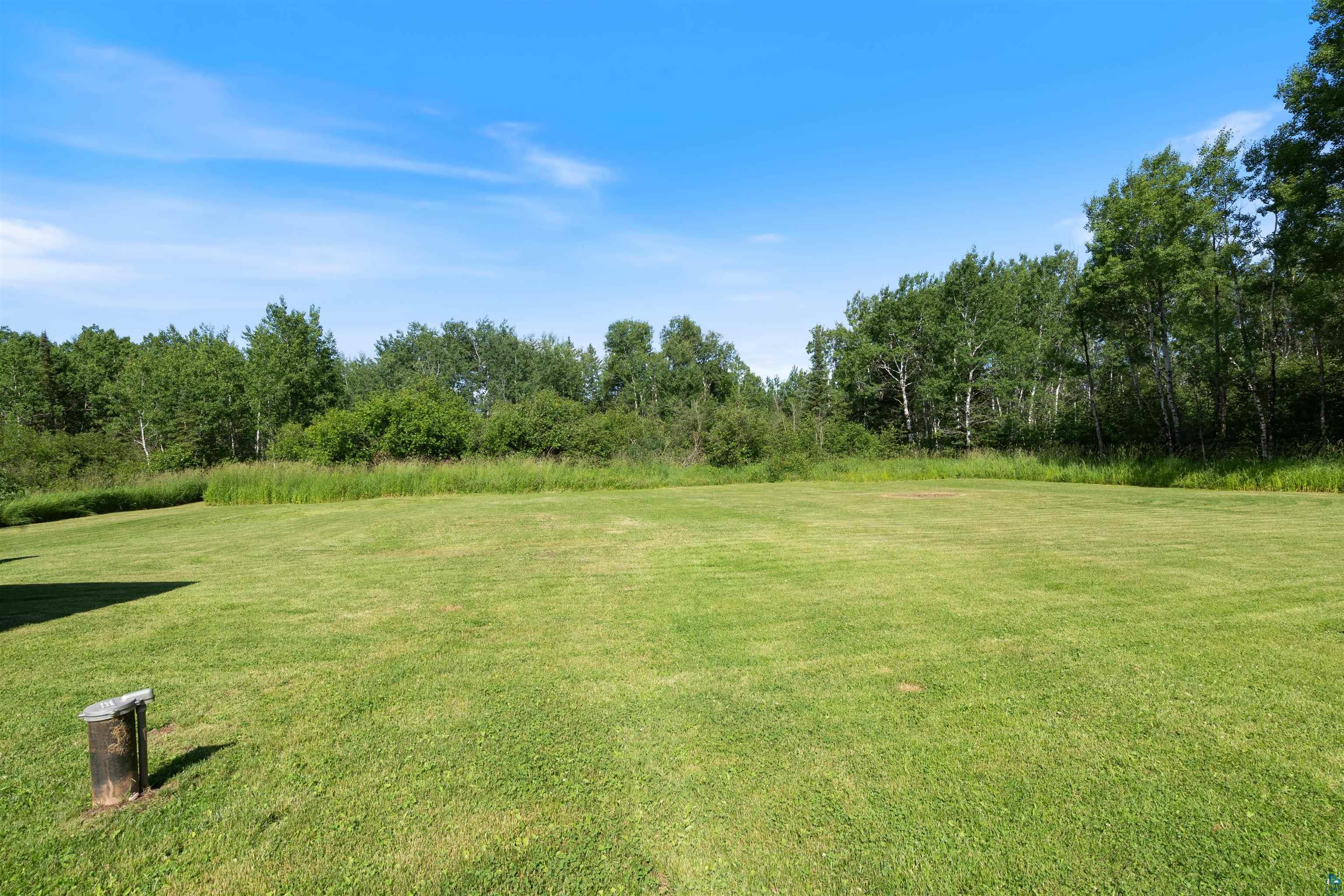 3835 South County Rd K South Range, WI 54874 - Photo 21 of 29 Expansive green lawn surrounded by mature trees