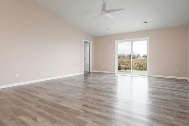 an open kitchen with dining table and chairs