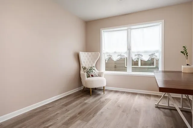 an empty room with closet and windows