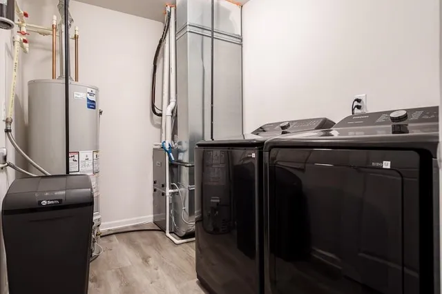 a view of room with window and wooden floor