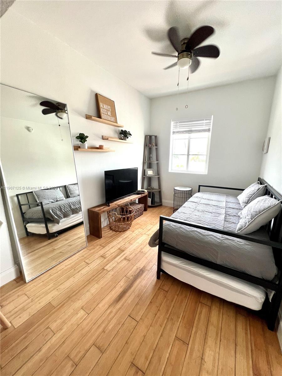 a bedroom with furniture and a fireplace