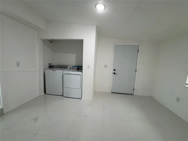 a utility room with washer and dryer
