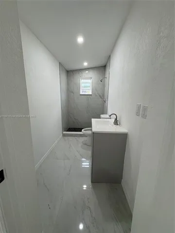 a view of a hallway with a sink