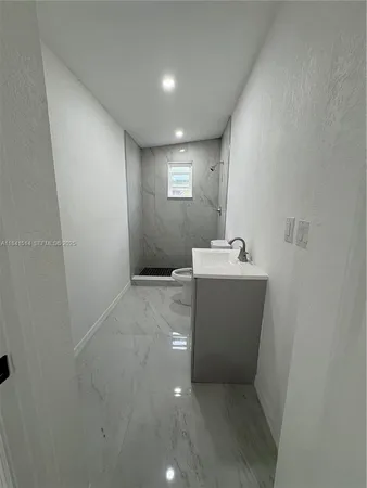a view of a hallway with a sink