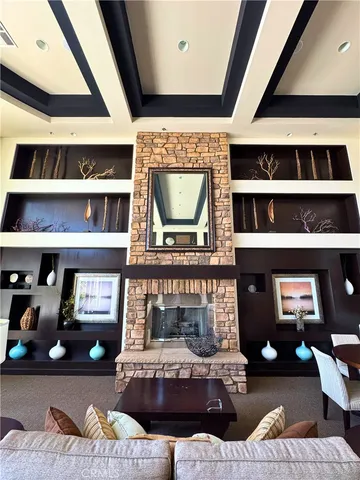 a living room with furniture and fireplace