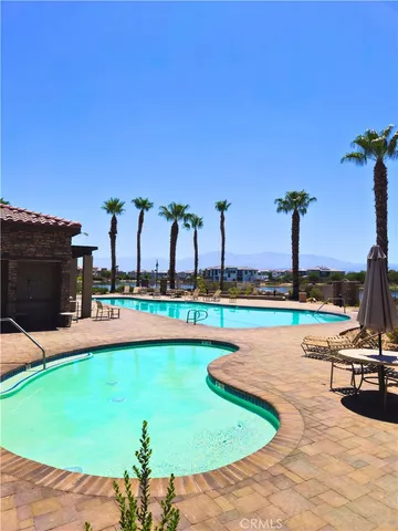 a view of a swimming pool and a yard