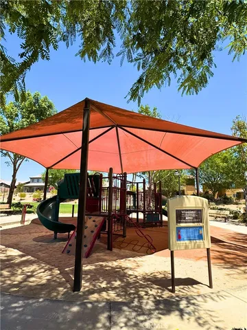 a view of a street with a bench and table