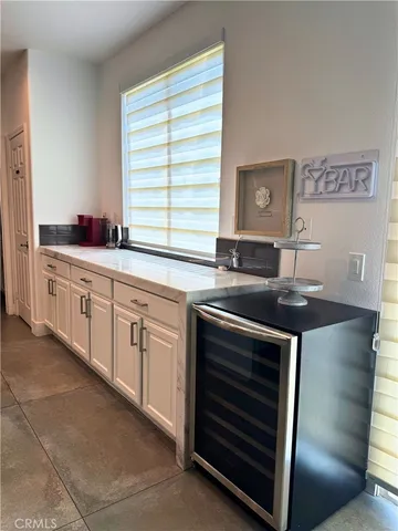 a kitchen with granite countertop a sink and a stove