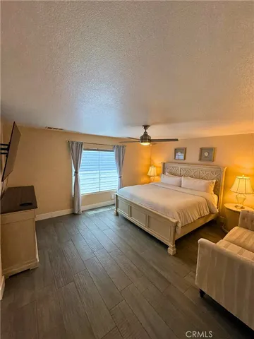 a bedroom with bed and window