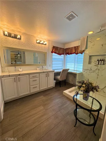 a kitchen with a sink cabinets and window