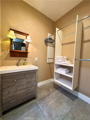 a bathroom with a double vanity sink a mirror and shower