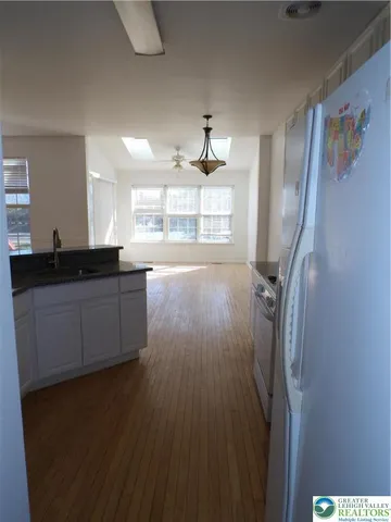 a bathroom with a sink and a window