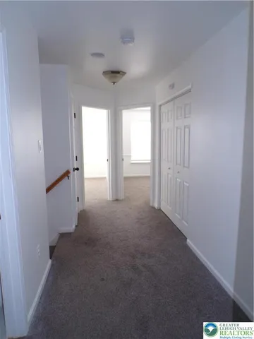 an empty room with a empty space and a window