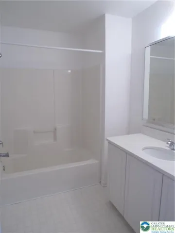 a view of an empty room and a window