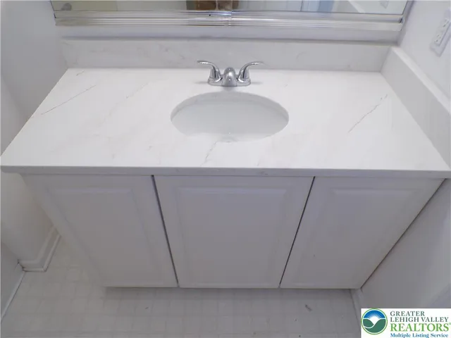 a bathroom with a sink and a toilet