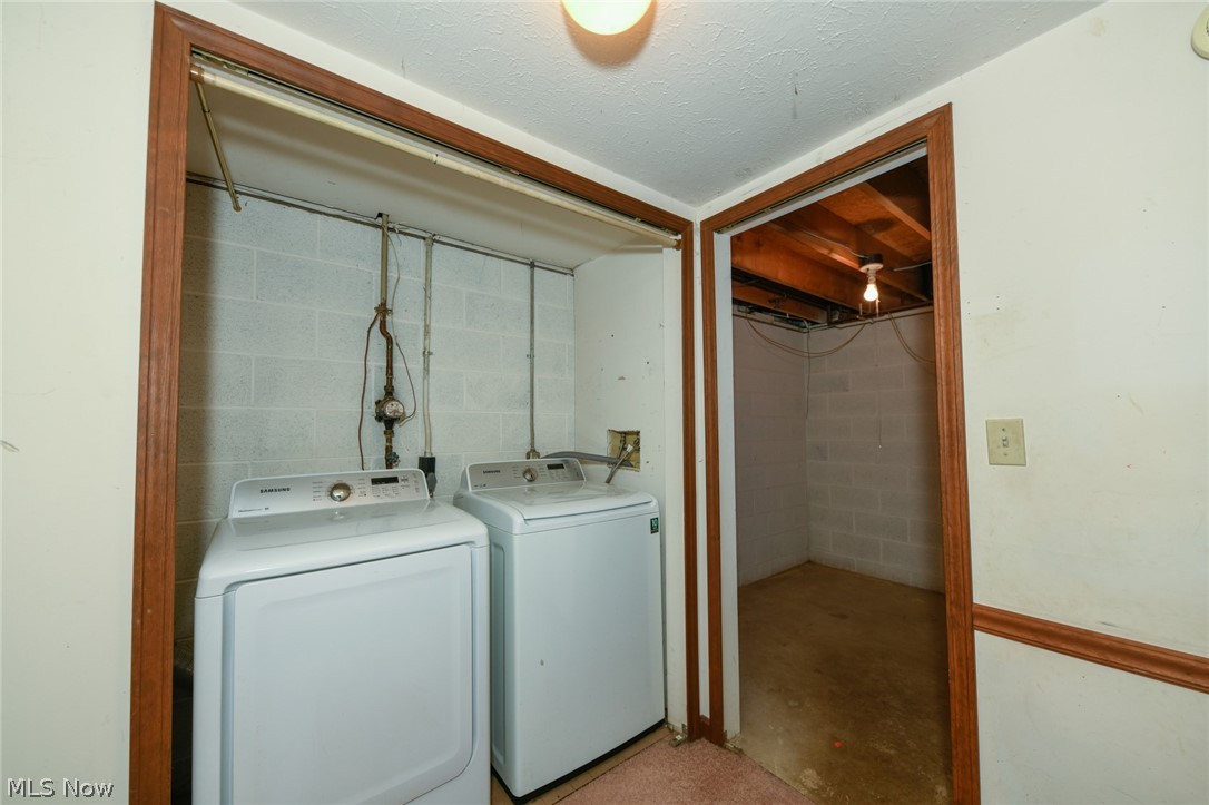 2715 Graham Road, Unit 4 Stow, OH 44224 - Photo 30 of 35 2715 Graham Rd #4, Stow, OH 44224 is an end unit condominium with 2 bedrooms, 1.5 bathrooms, 1 car garage, finished basement, laundry in lower level, huge side yard with pet fence & 3 collars provided, open floor plan from galley kitchen with oak cabinets & appliances to the large living room with wood burning fireplace, sliding glass doors to rear deck and sitting porch up front.